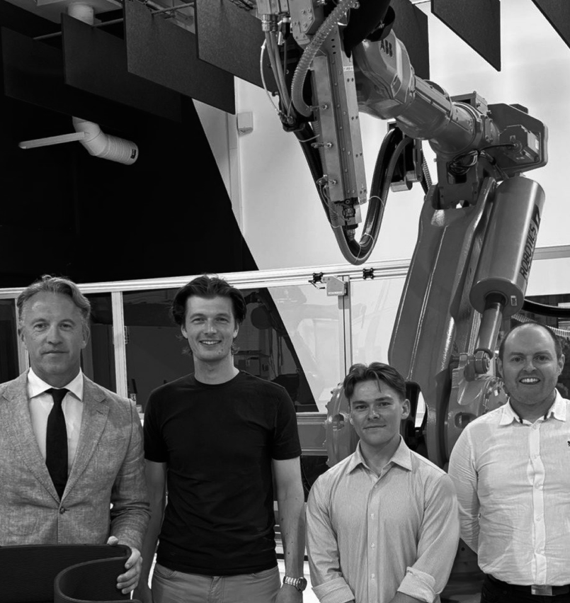 The Zerolab team in front of the robotic printing cell