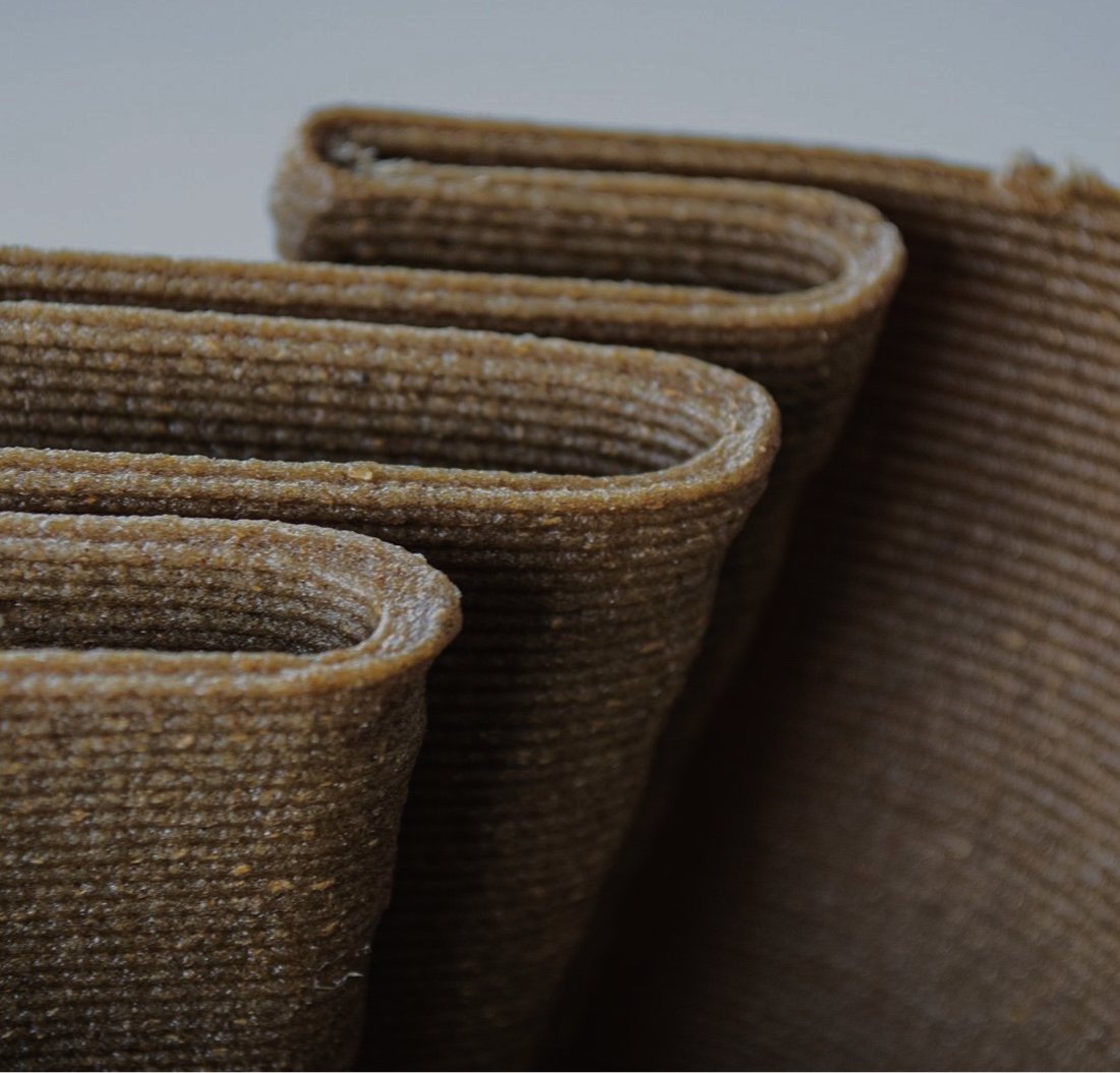 Close-up of 3D-printed research material showing curved layered walls